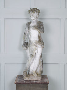 A Carved Stone Standing Male Figure with Crown