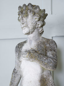 A Carved Stone Standing Male Figure with Crown