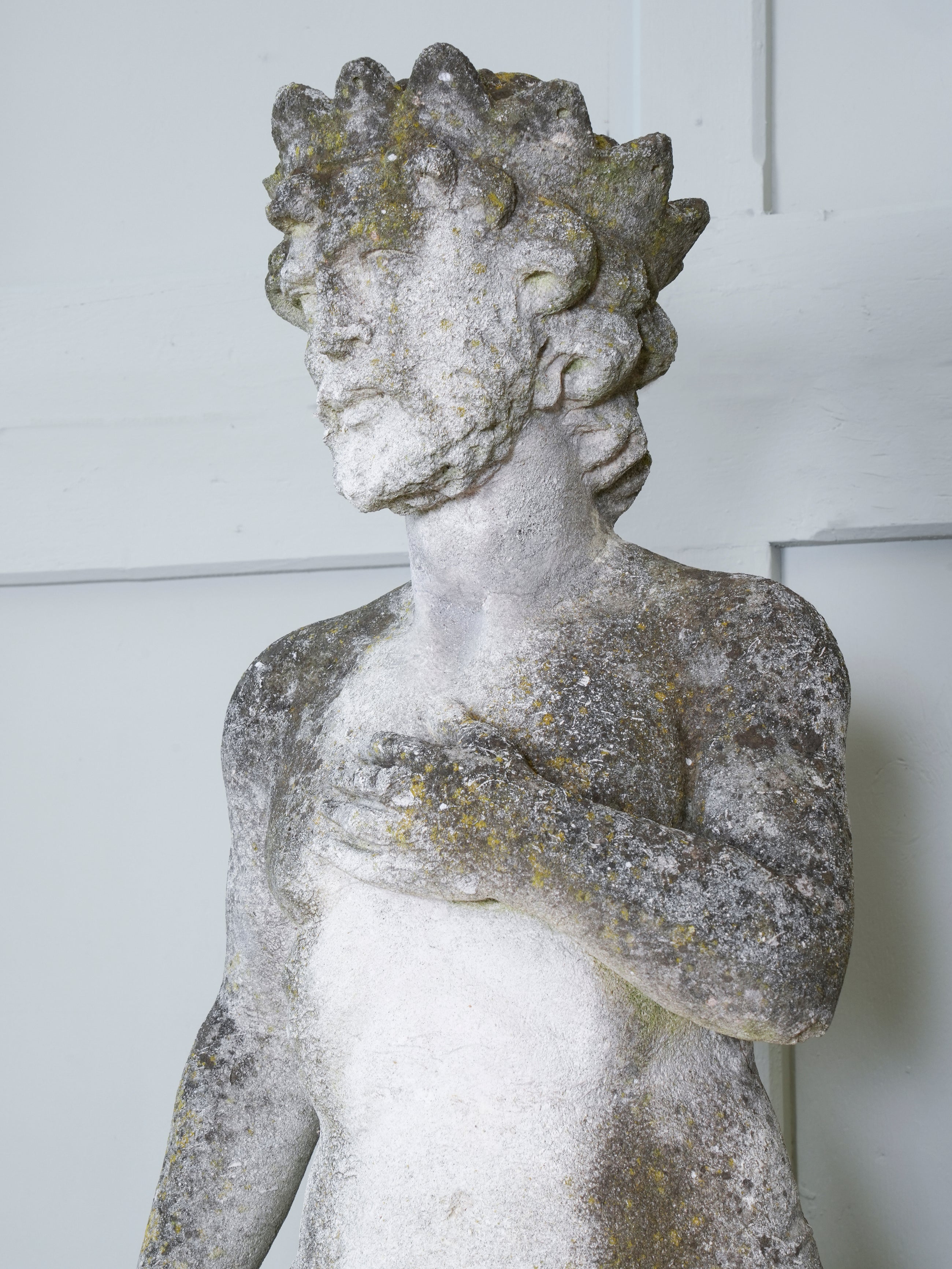 A Carved Stone Standing Male Figure with Crown