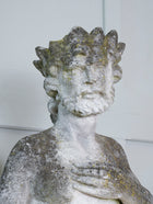 A Carved Stone Standing Male Figure with Crown