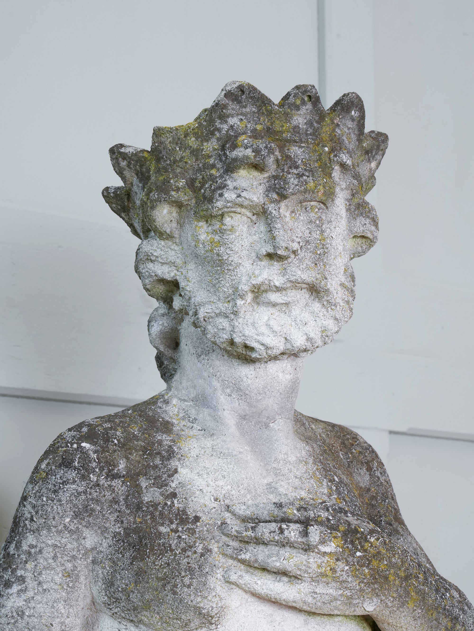 A Carved Stone Standing Male Figure with Crown