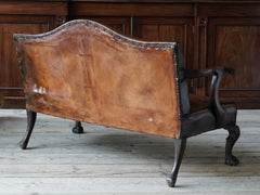 A Diminutive Leather Sofa