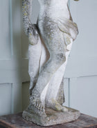 A Carved Stone Standing Male Figure with Crown