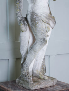 A Carved Stone Standing Male Figure with Crown