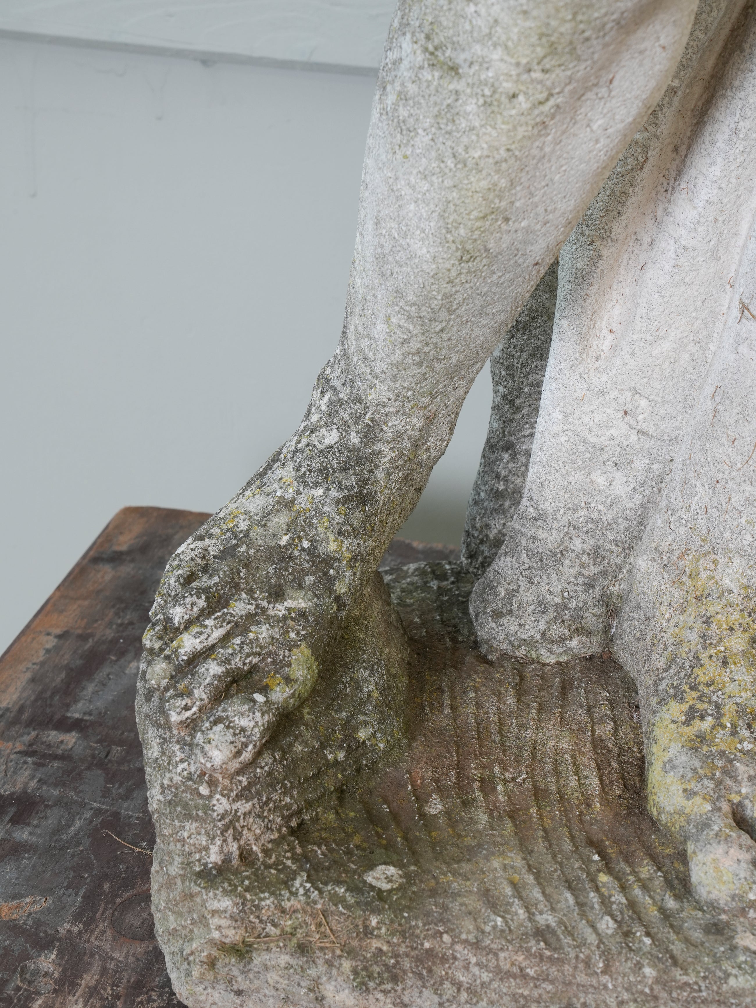 A Carved Stone Standing Male Figure with Crown