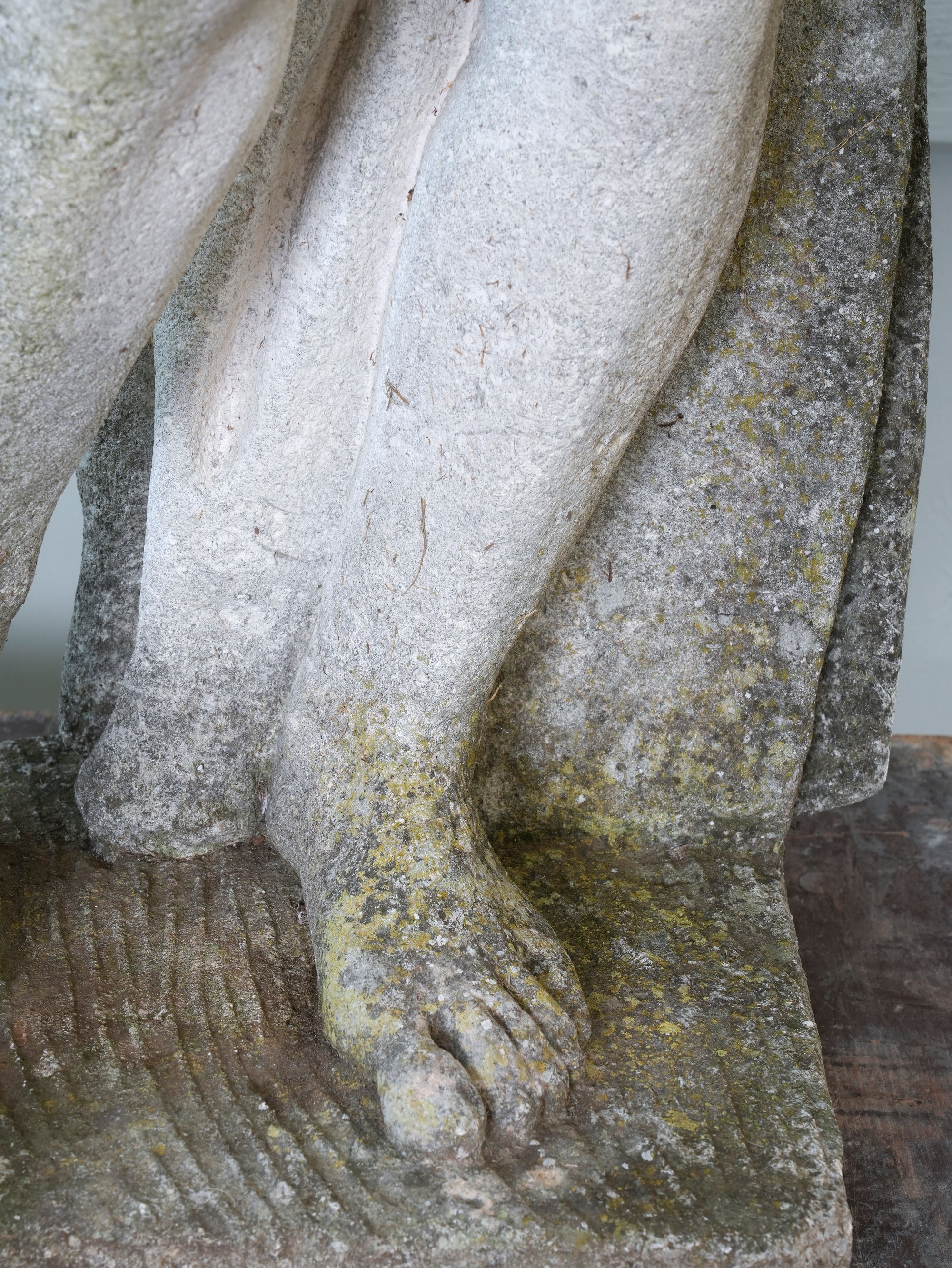 A Carved Stone Standing Male Figure with Crown