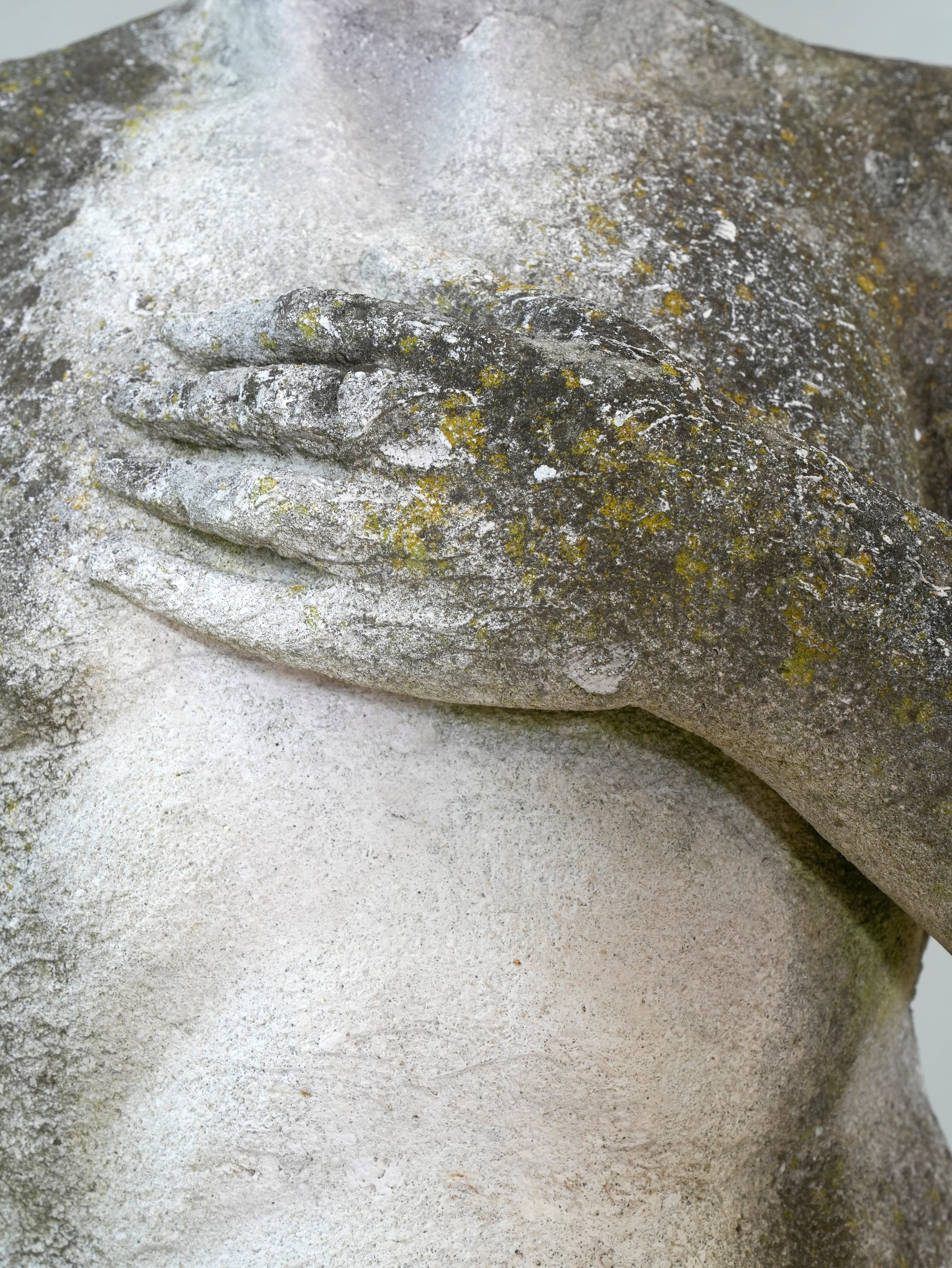 A Carved Stone Standing Male Figure with Crown