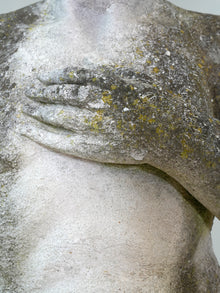A Carved Stone Standing Male Figure with Crown