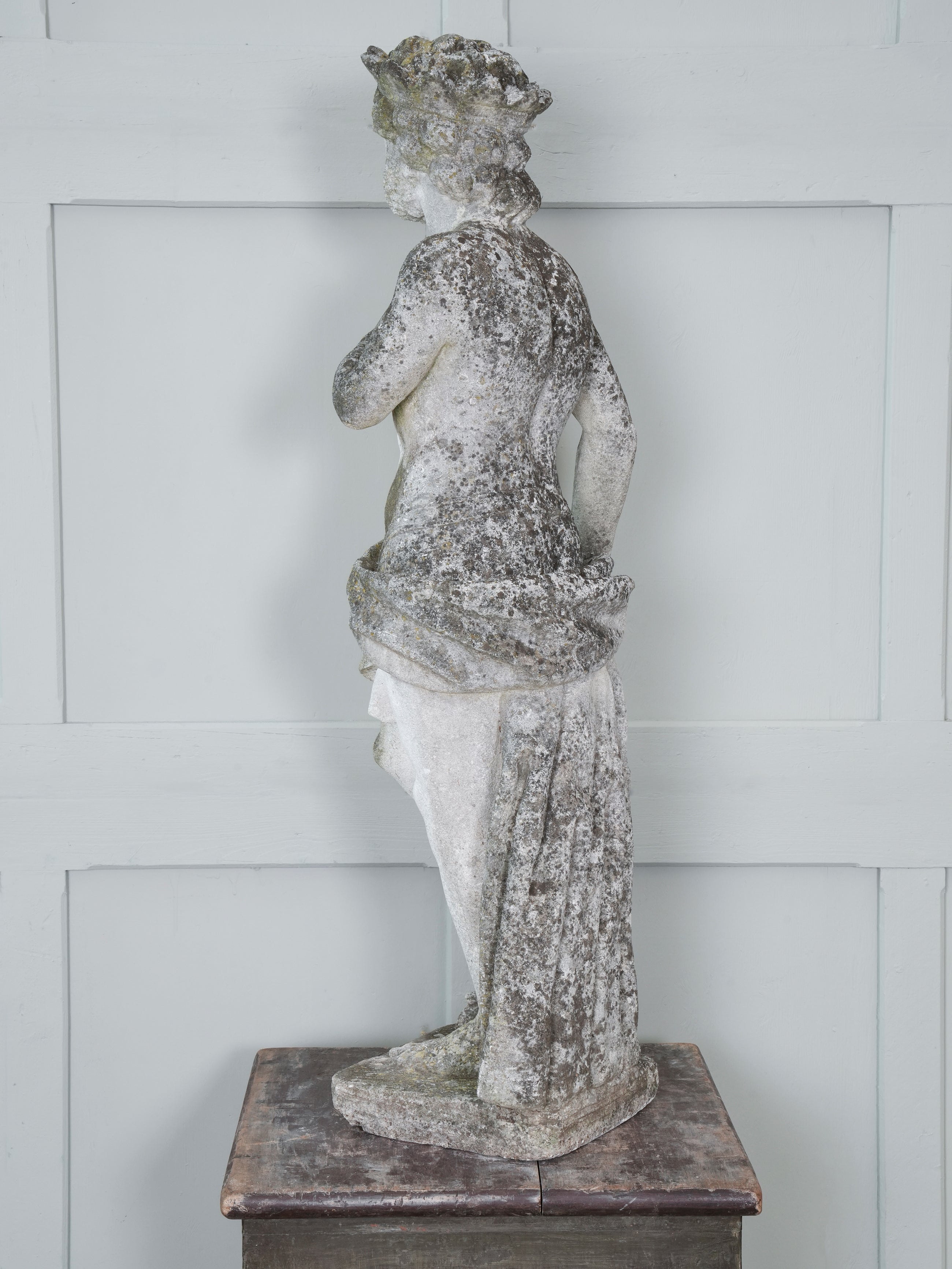 A Carved Stone Standing Male Figure with Crown