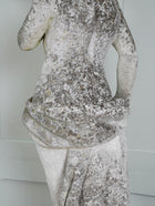 A Carved Stone Standing Male Figure with Crown