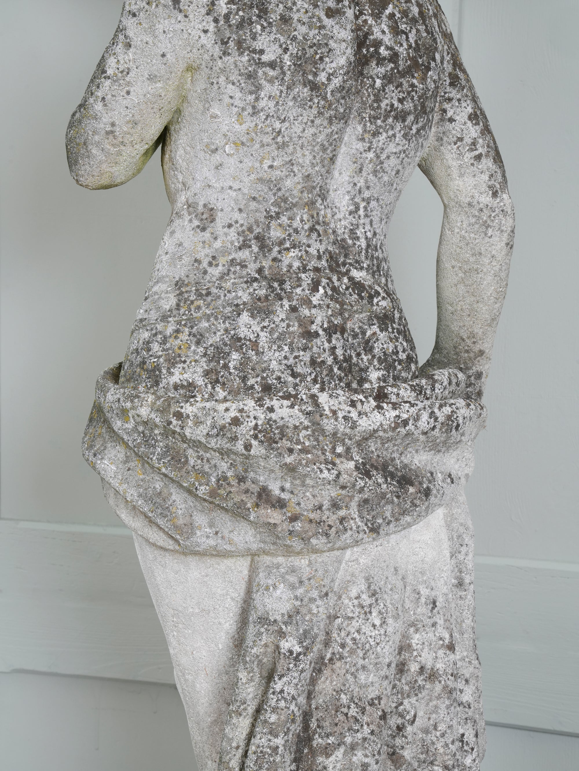 A Carved Stone Standing Male Figure with Crown