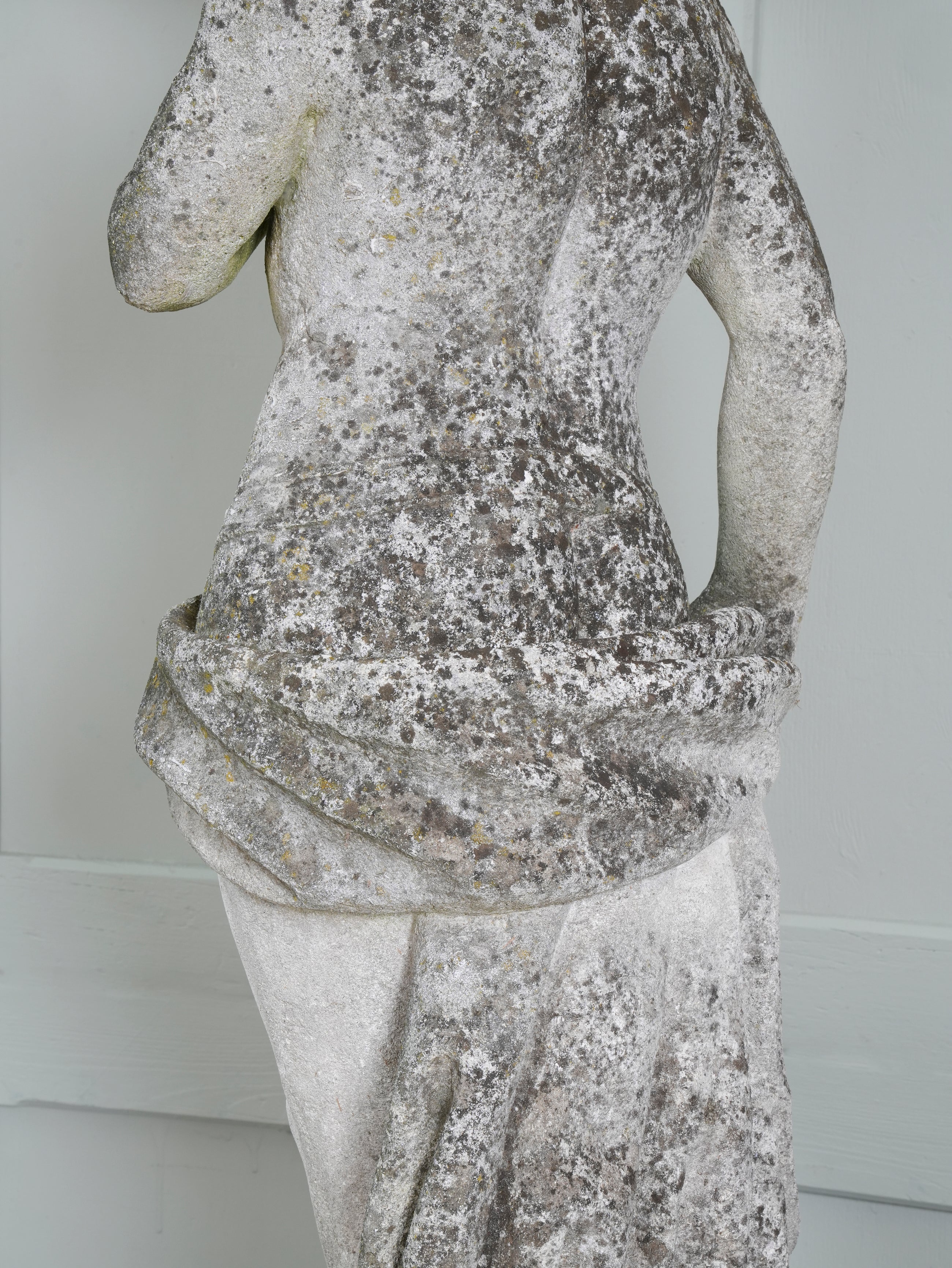 A Carved Stone Standing Male Figure with Crown