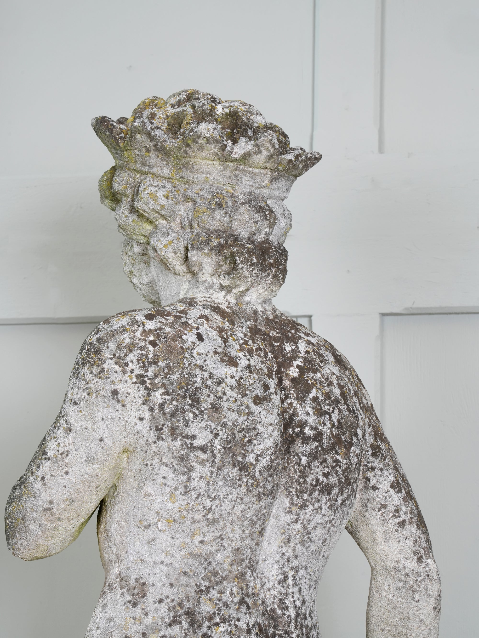 A Carved Stone Standing Male Figure with Crown