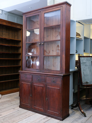 A Glazed Pine Bookcase On Cupboard