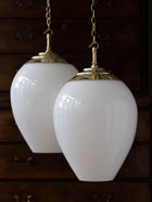 The Eirlys Opaline Glass Pendant in Polished Brass